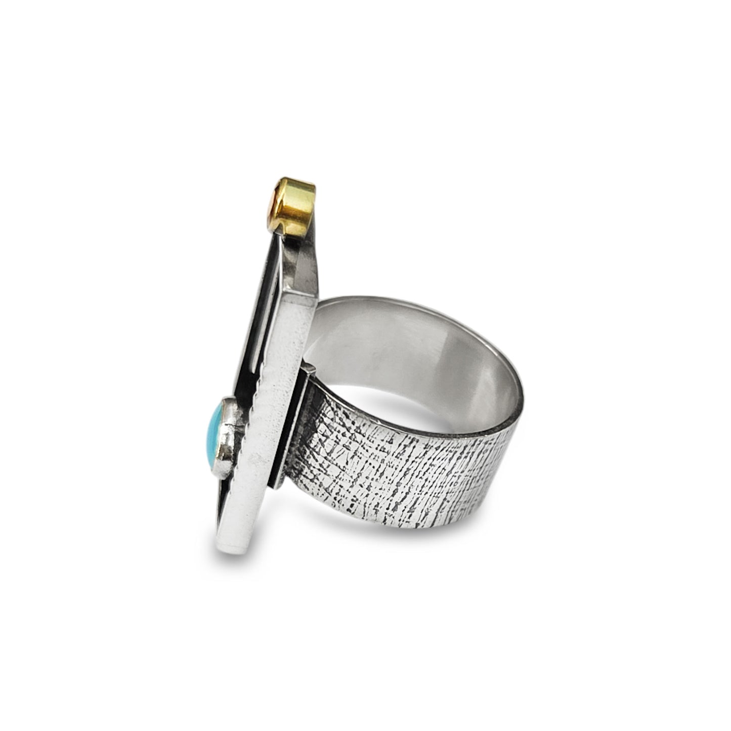 Silver ring with textured band and gold accents on a white background