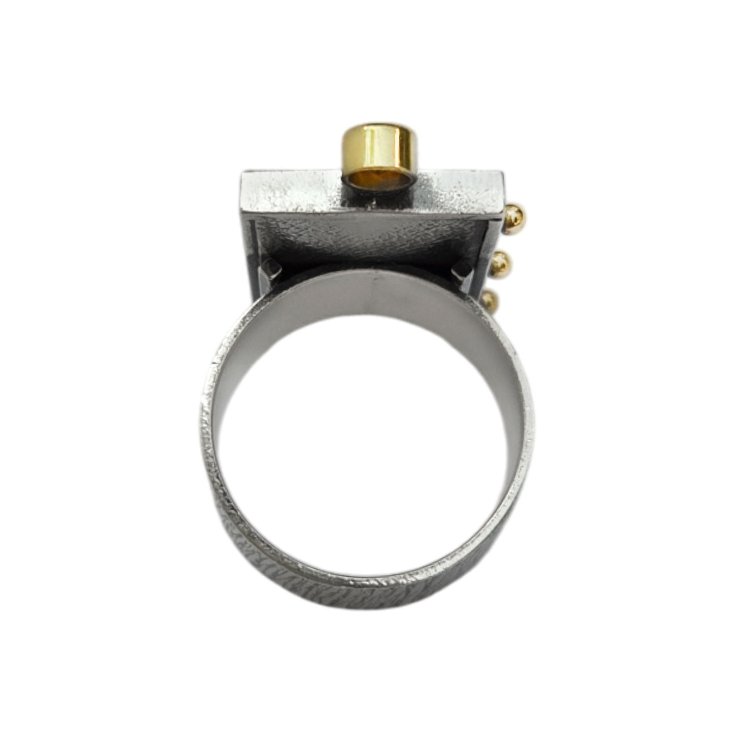 Silver ring with gold accents on a white background