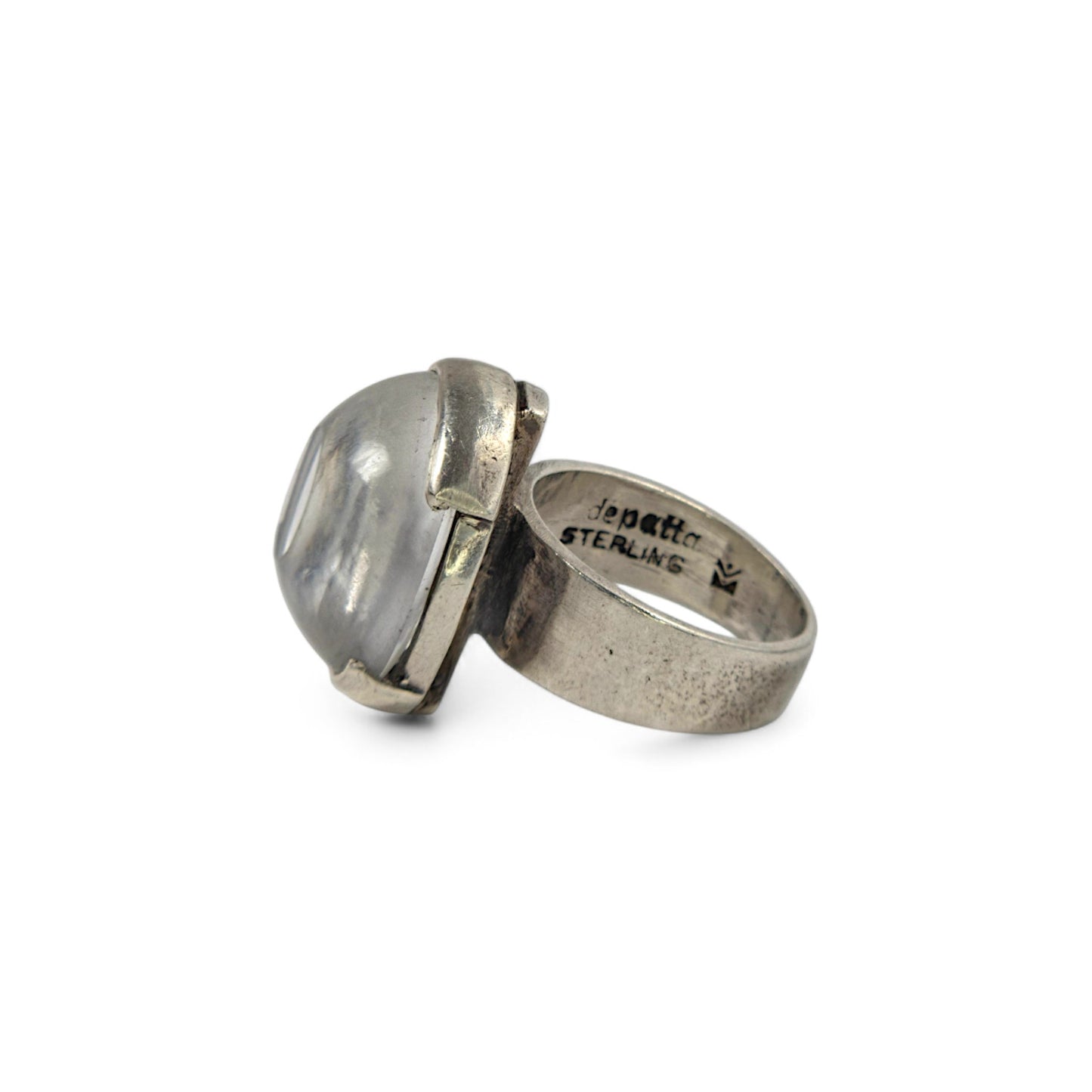 Silver ring featuring a large stone on a white background
