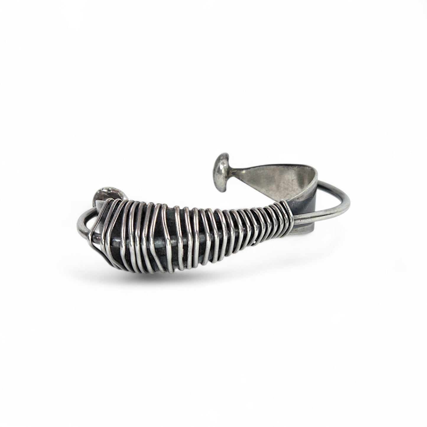 Silver wire bracelet on a white background