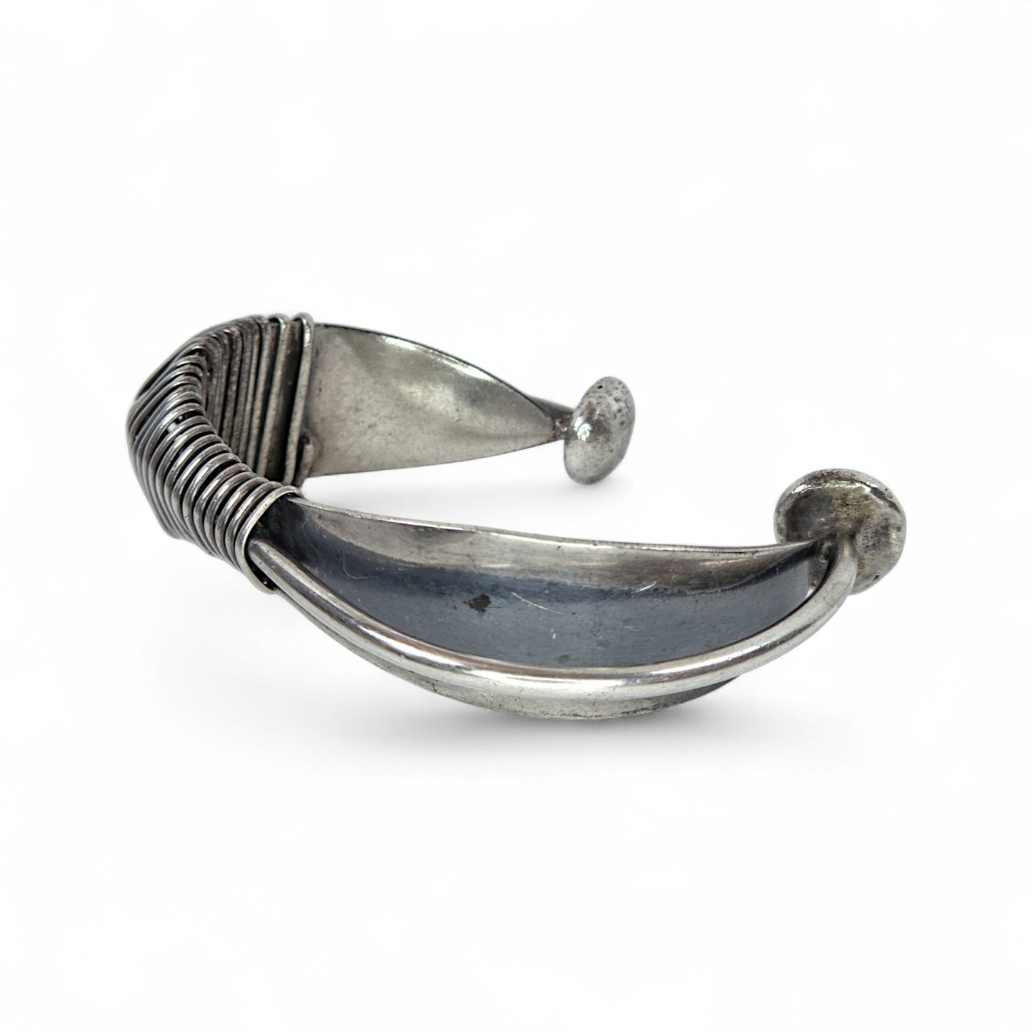 Silver bracelet with a unique design on a white background