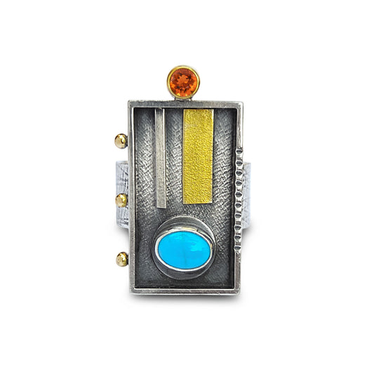 Multicolored ring with turquoise stone, gold accents, and amber gemstone on a white background