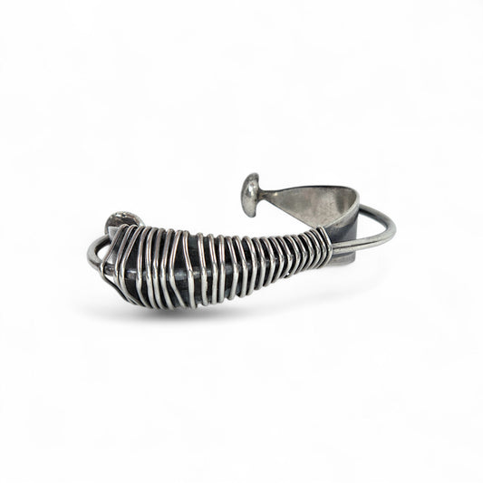 Silver wire bracelet on a white background