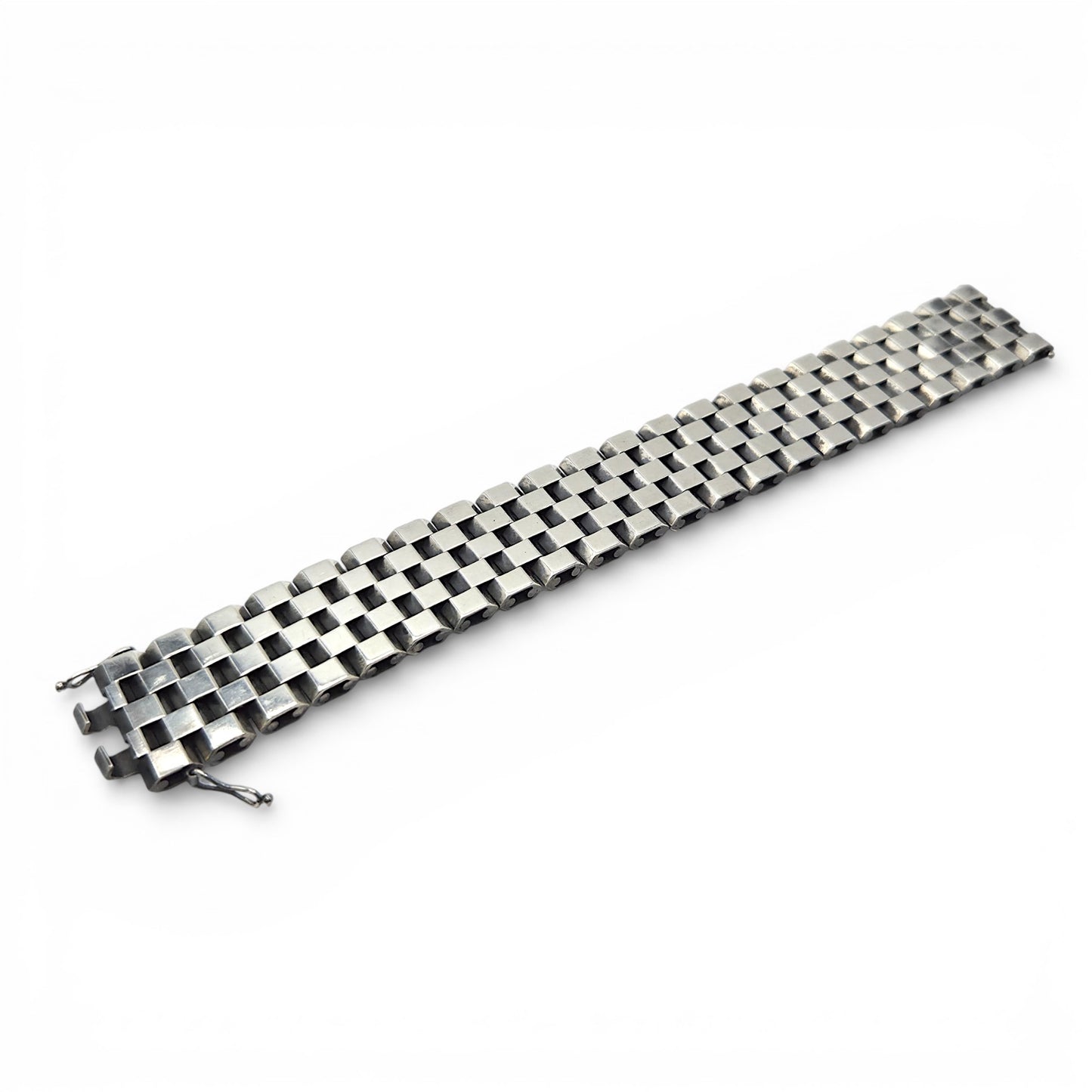 Metallic bracelet with a woven pattern on a white background