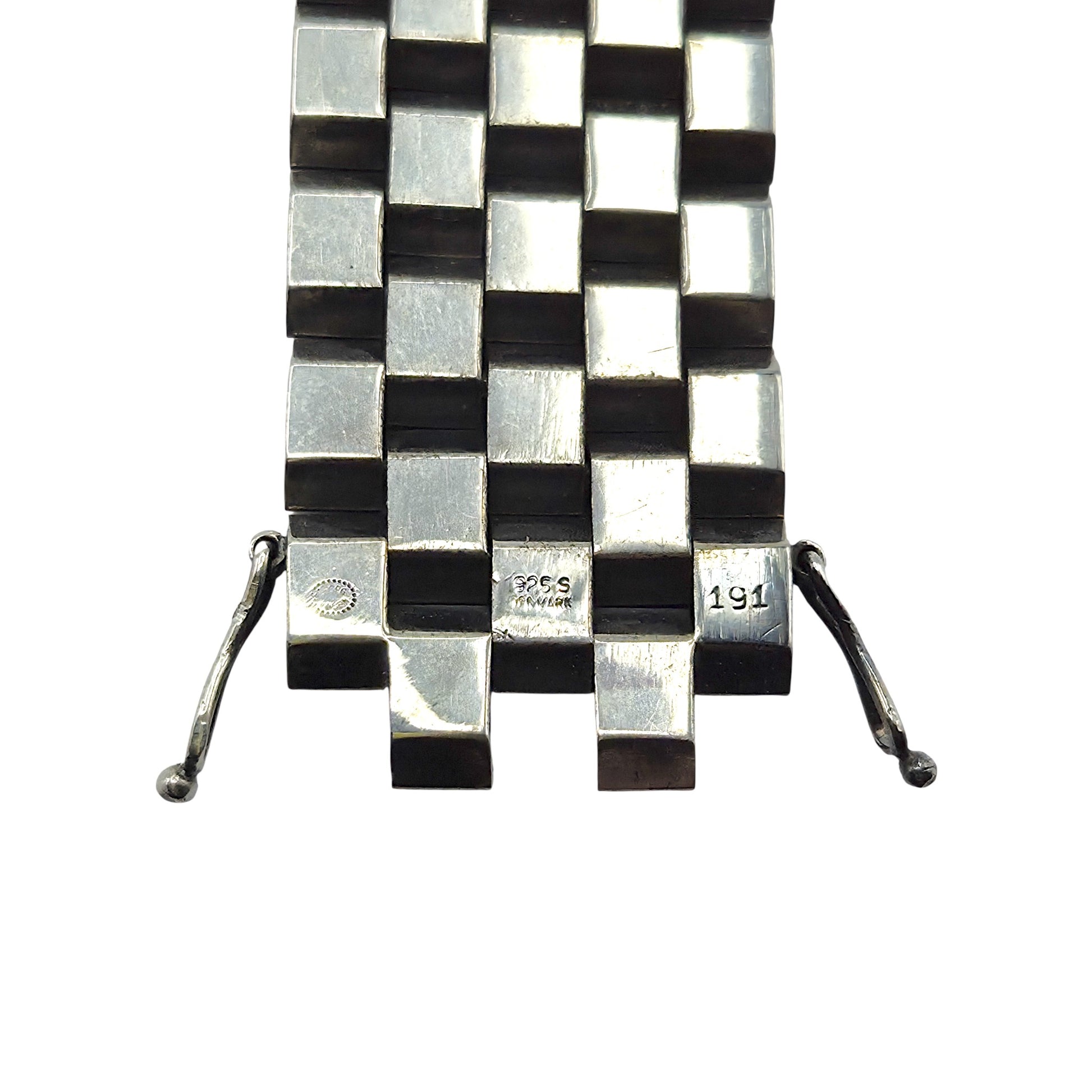 Silver checkered bracelet on a white background
