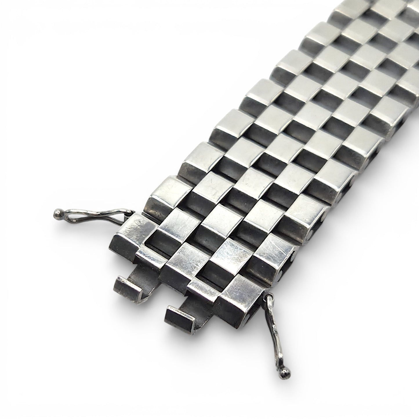 Silver checkered bracelet on a white background