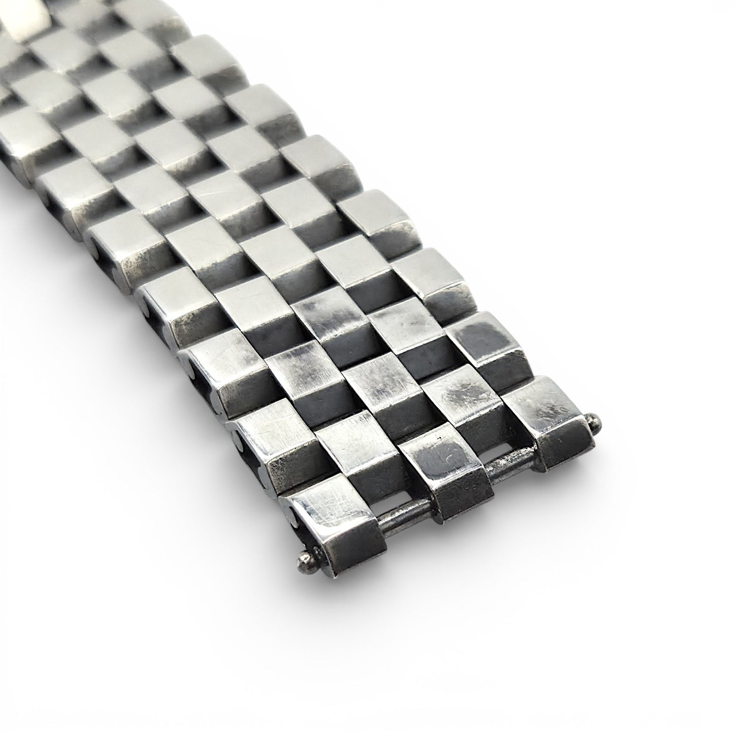 Silver checkered bracelet on a white background