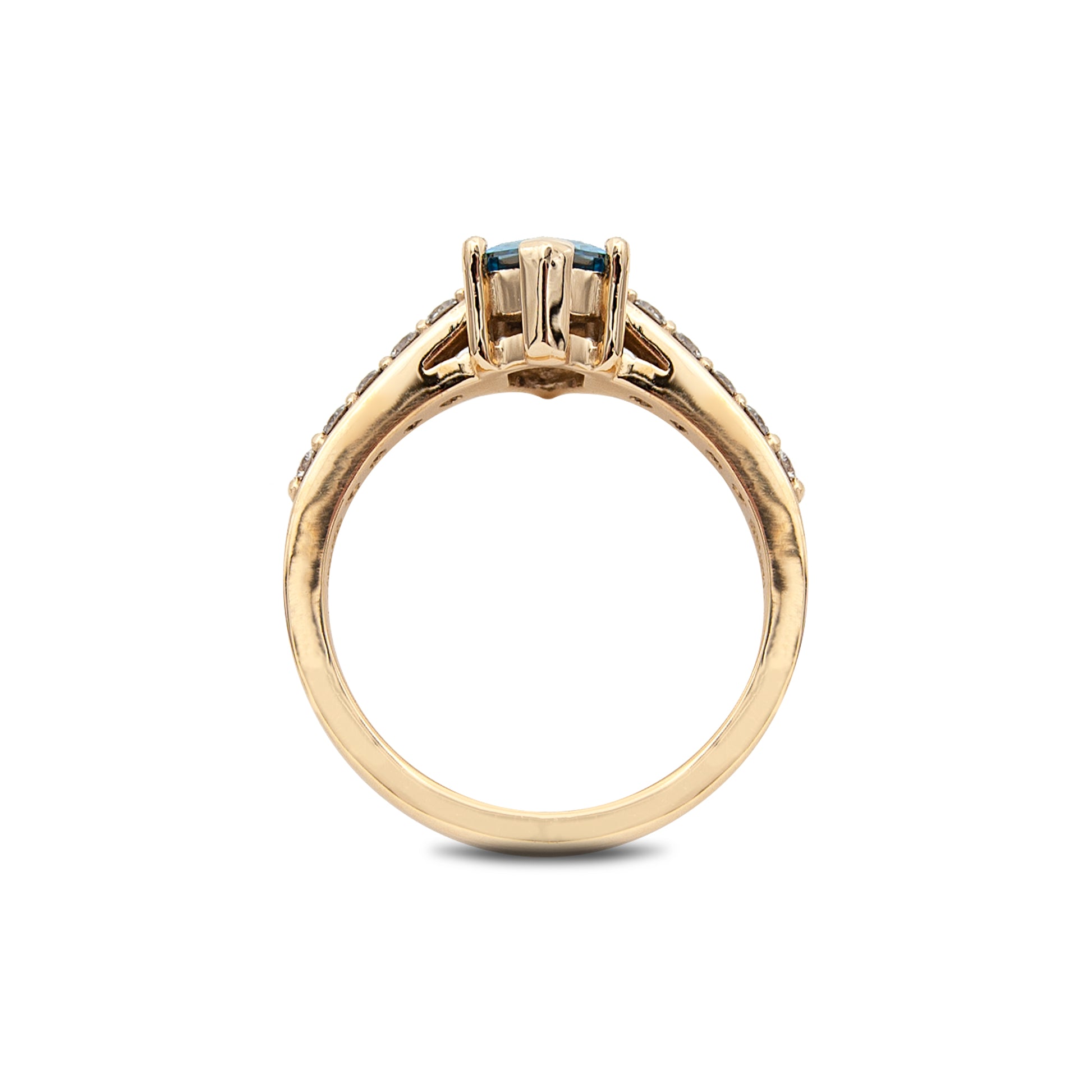 Gold ring with a central gemstone on a white background