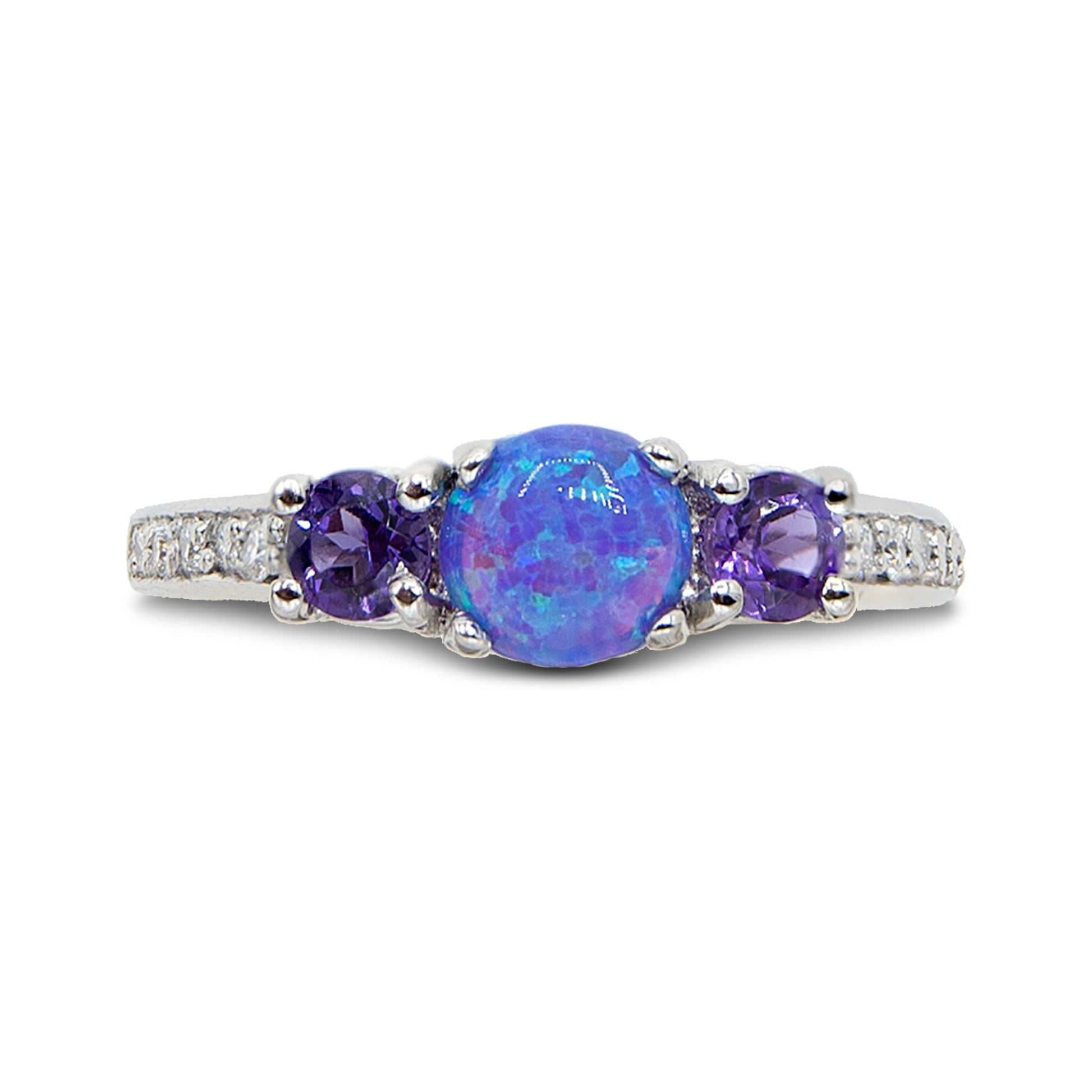 Ring with a blue opal and purple gemstones on a white background