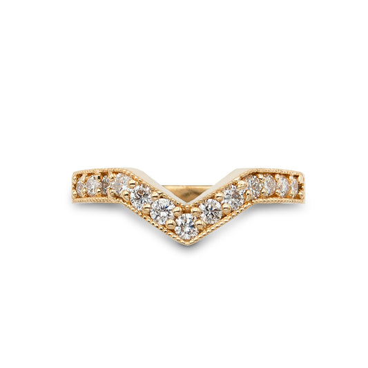 Gold and diamond ring on a white background