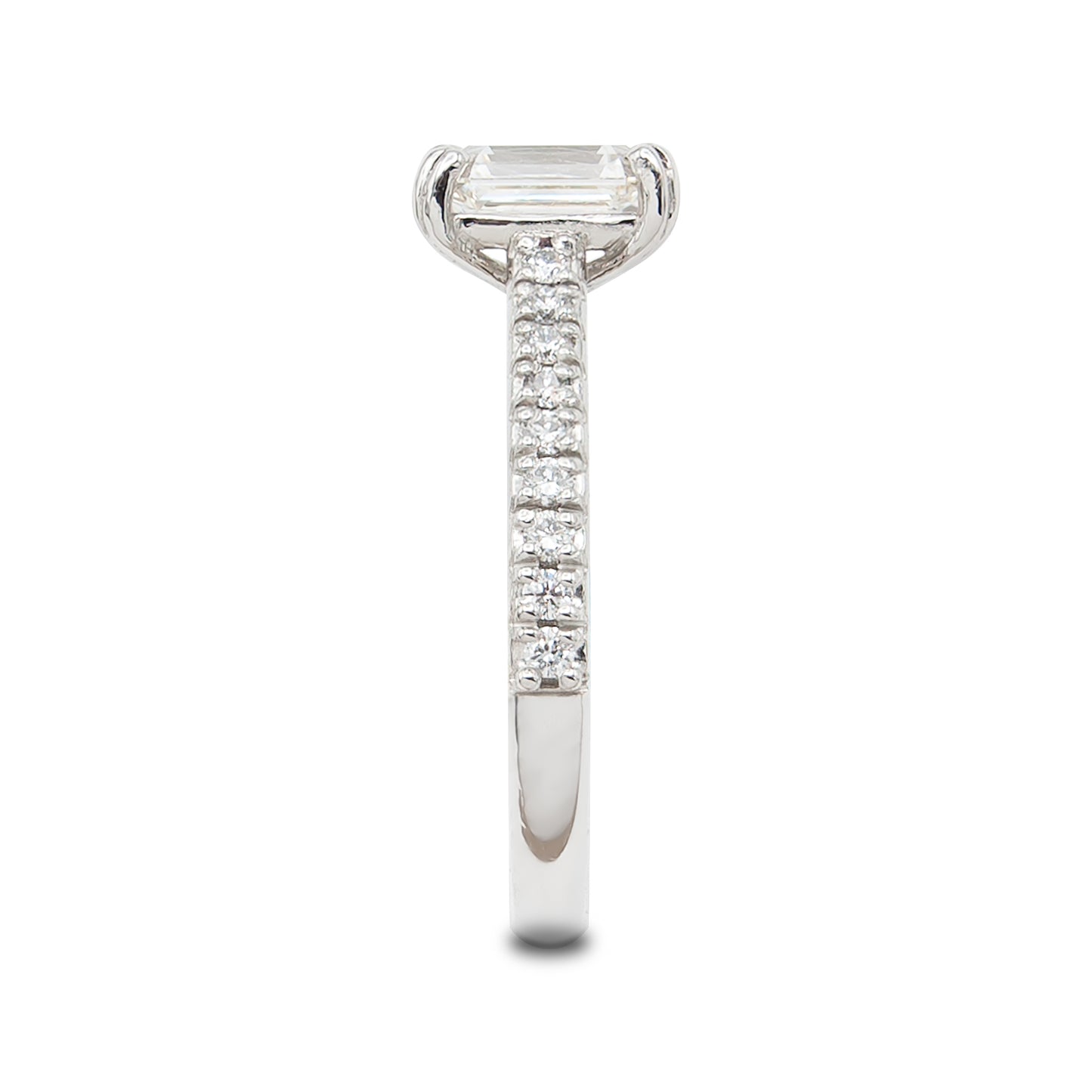 Diamond ring with a emerald-cut center stone on a white background
